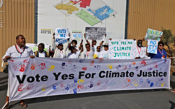 Members of Pacific Island Students Fighting Climate Change stage a protest during the COP27 climate conference in Sharm el-Sheikh, Egypt