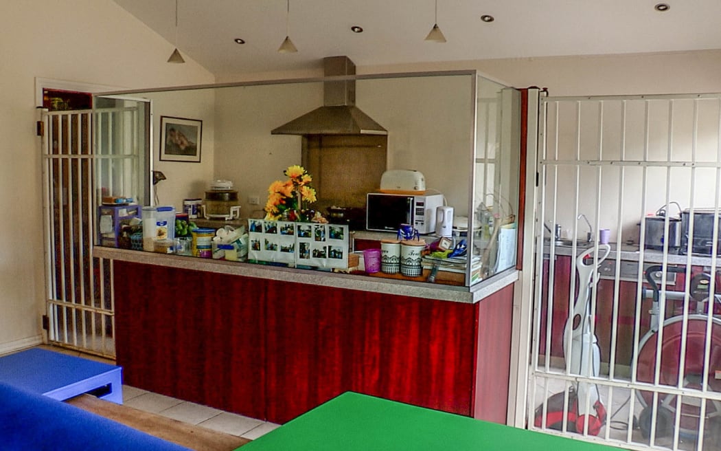 The kitchen modifications, including barred doors & prision grade glass screens, in Devora Busch's family home to keep her daughter Rheegan safe