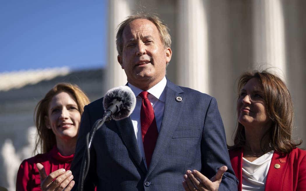WASHINGTON, DC - NOVEMBER 01: Texas Attorney General Ken Paxton speaks outside the U.S. Supreme Court on November 01, 2021 in Washington, DC. On Monday, the Supreme Court heard arguments in a challenge to the controversial Texas abortion law which bans abortions after 6 weeks.   Drew Angerer/Getty Images/AFP (Photo by Drew Angerer / GETTY IMAGES NORTH AMERICA / Getty Images via AFP)