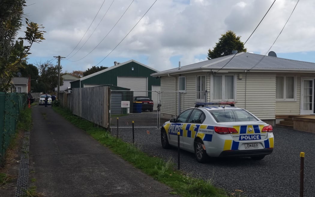 Police at a property in Henderson, west Auckland, 25/5/2022.