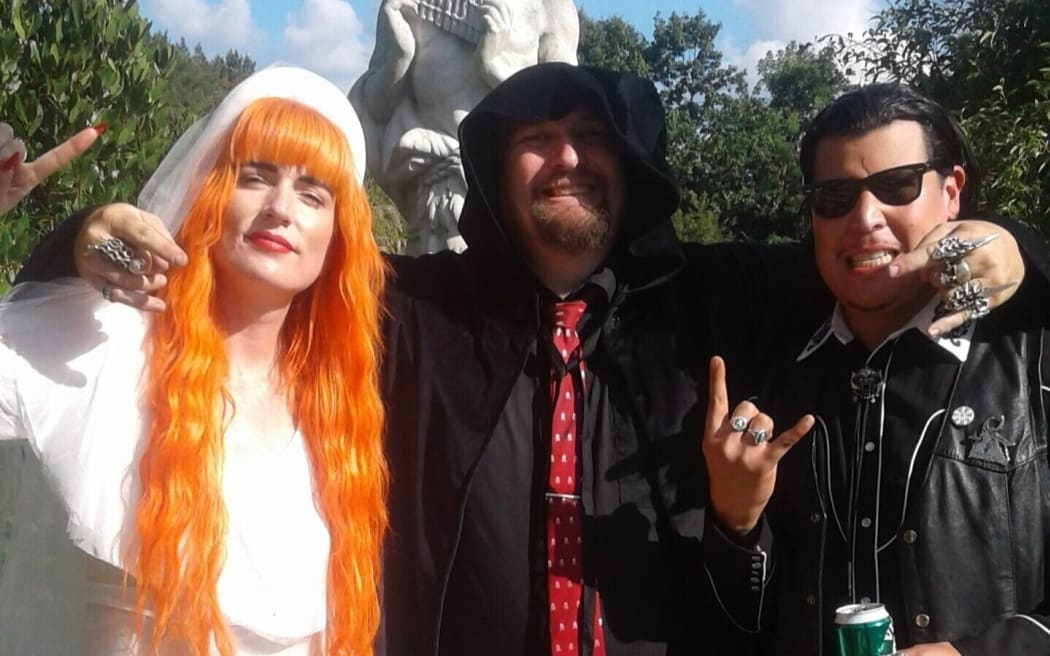 Extreme wedding celebrant and Whanganui District Council candidate Scott Phillips (centre) after performing a marriage ceremony.