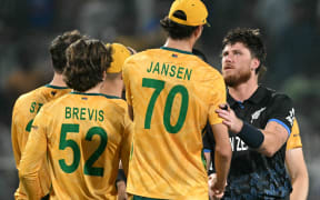 South Africa's Marco Jansen congratulates New Zealand's Finn Allen after the Black Caps' win in their T20 World Cup semifinal in Kolkata,  March 4, 2026. (Photo by Dibyangshu SARKAR / AFP)