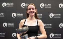 Jena Gregory, from Hawke’s Bay, holds the trophy she claimed for winning the New Zealand women’s squash championship in Tauranga, 5 July, 2026. (Photo: Squash NZ)