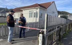 An armed police officer was guarding the scene of a shooting in the Lower Hutt suburb of Naenae, 11 December 2024.