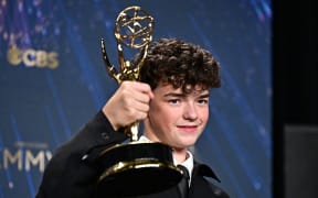 British actor Owen Cooper poses in the press room with the award for Outstanding Supporting Actor in a Limited or Anthology Series or Movie for "Adolescence" during the 77th Primetime Emmy Awards at the Peacock Theatre at LA Live in Los Angeles on September 14, 2025.