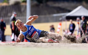 Ethan Olivier competes in the triple jump during the 2024 National Track & Field Championships in Wellington.