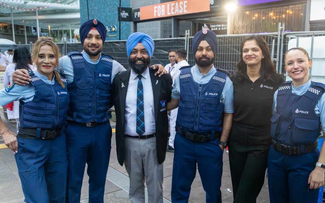 (From left) Senior Constable Sarah Su, Constable Harmanjot Singh, Parminder Singh, Constable Talwinder Singh, Karanbir Kaur and Detective Rowan McKinlay-Sadgrove after their performance at the Auckland Diwali festival on Sunday.
