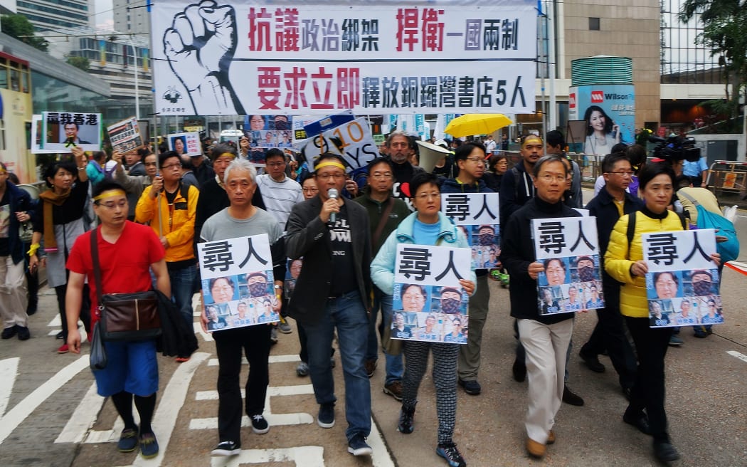 Crowds gather calling for free speech in response to the disappearance of five booksellers from Hong Kong.