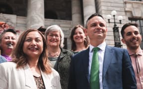 The Green Party getting a photo taken outside Parliament on the first day of the new term.