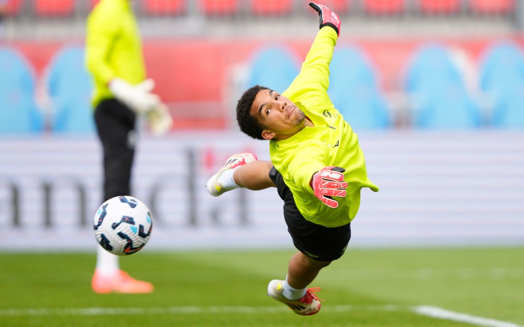 Goalkeeper Alex Paulsen of New Zealand warms up.