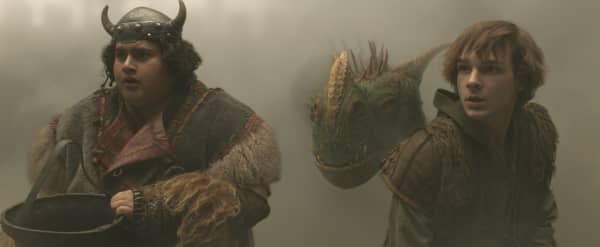 (from left) Fishlegs (Julian Dennison) and Hiccup (Mason Thames) in Universal Pictures’ live-action How to Train Your Dragon, written and directed by Dean DeBlois.