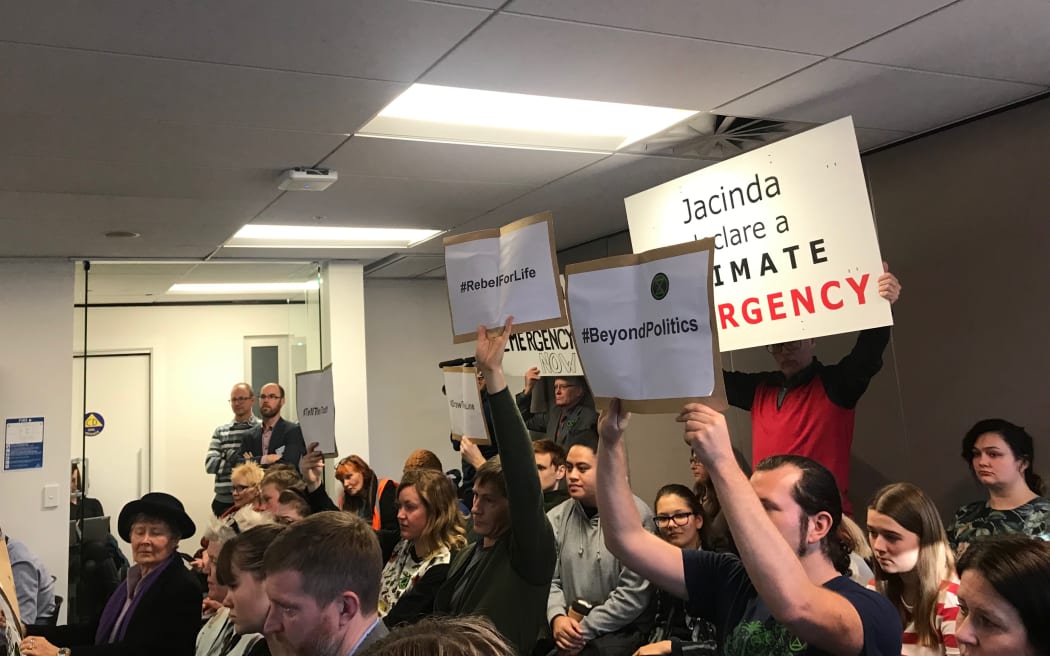 People at the council meeting calling for it to declare a climate emergency.