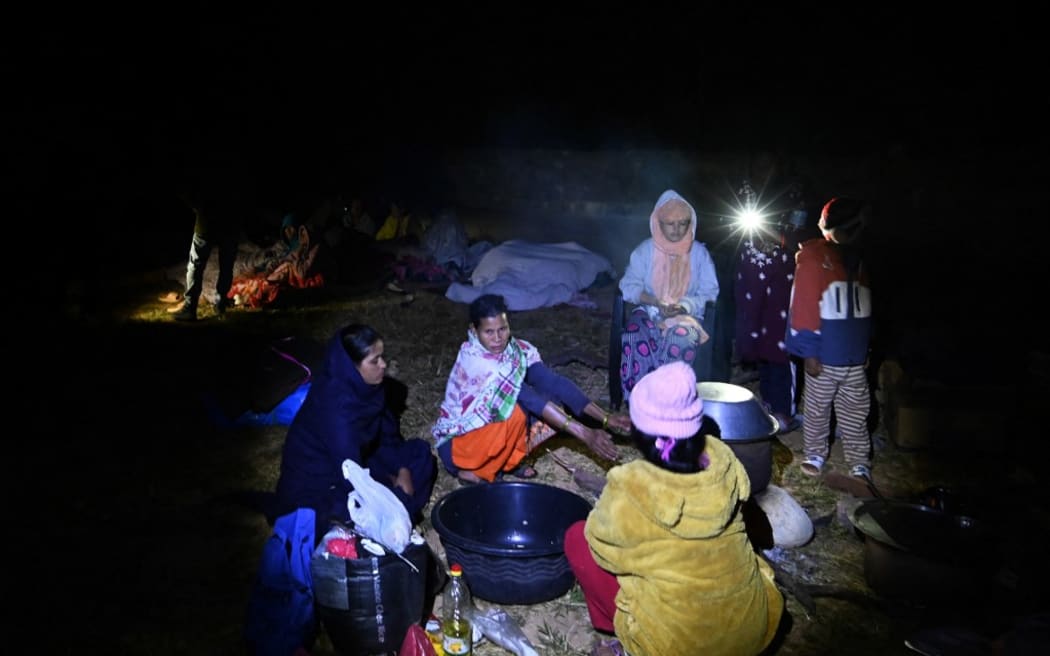 Residents gather at an open air area in Jajarkot district on November 4, 2023, after a 5.6-magnitude earthquake.