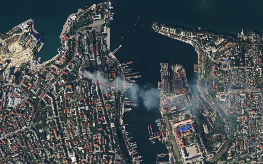This handout satellite image released on September 23, 2023 by Planet Labs PBC shows an aerial view of the city of Sevastopol after a missile attack struck the headquarters of Moscow's Black Sea fleet in annexed Crimea on September 22, 2023, sparking a huge fire and leaving at least one Russian serviceman missing. The strike on the symbolic heart of Russia's Black Sea fleet marks a major blow for Moscow, which has suffered a string of attacks on the strategically important port in recent months. (Photo by Handout / Planet Labs PBC / AFP) / RESTRICTED TO EDITORIAL USE - MANDATORY CREDIT "AFP PHOTO / PLANET LABS PBC" - NO MARKETING - NO ADVERTISING CAMPAIGNS - DISTRIBUTED AS A SERVICE TO CLIENTS
RESTRICTED TO EDITORIAL USE - MANDATORY CREDIT "AFP PHOTO / PLANET LABS PBC" - NO MARKETING - NO ADVERTISING CAMPAIGNS - DISTRIBUTED AS A SERVICE TO CLIENTS /