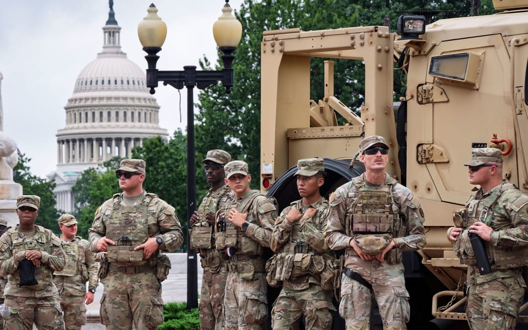 National Guard troops congregate at the entrance to Union Station in Washington, DC, on 20 August, 2025.