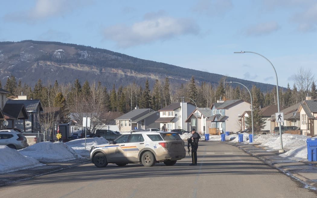 This photograph provided by local journalist Trent Ernst shows a place near the middle school and high school building where a shooting took place, leaving at least nine people dead in the small town of Tumbler Ridge, British Columbia, on February 10, 2026. (Photo by Trent Ernst / AFP) / XGTY / RESTRICTED TO EDITORIAL USE - MANDATORY CREDIT "AFP PHOTO / TRENT ERNST" - NO MARKETING NO ADVERTISING CAMPAIGNS - DISTRIBUTED AS A SERVICE TO CLIENTS