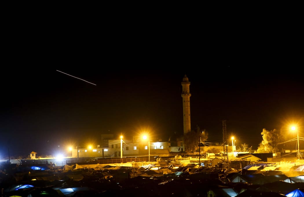 Turkish troops shell Kurdish positions in Syria.