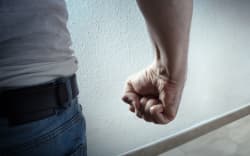 Man with curled fist - generic domestic violence image.