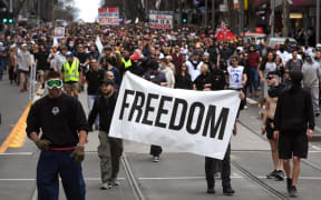 Protesters march through the streets during an anti-lockdown rally in Melbourne on 21 August.