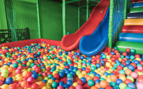 slides and pool with colorful balls in entertainment center