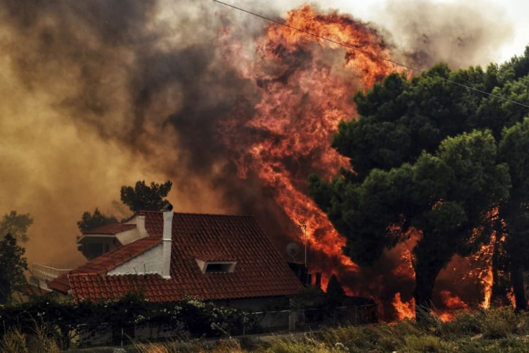 More than 300 firefighters, five aircraft and two helicopters have been mobilised to tackle the "extremely difficult" situation due to strong gusts of wind, Athens fire chief Achille Tzouvaras said.