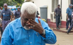Willie Jimmy wipes away a tear as he exits, head bowed, from the Supreme Court. Alone of the 15 MPs facing sentencing, Mr Jimmy's sentence of 20 months was suspended for two years.