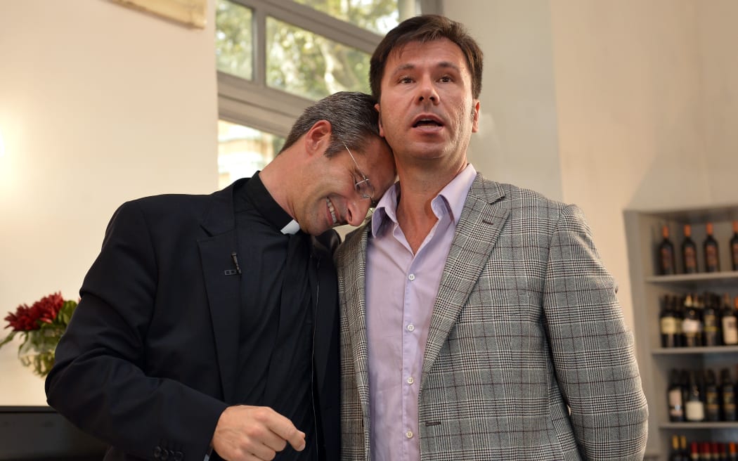 Father Krysztof Olaf Charamsa (L), with his partner Edouard.