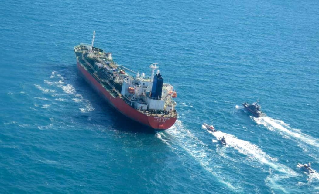 A picture obtained by AFP from the Iranian news agency Tasnim on 4 January 2021, shows the South Korean-flagged tanker being escorted by Iran's Revolutionary Guards navy after being seized in the Gulf.