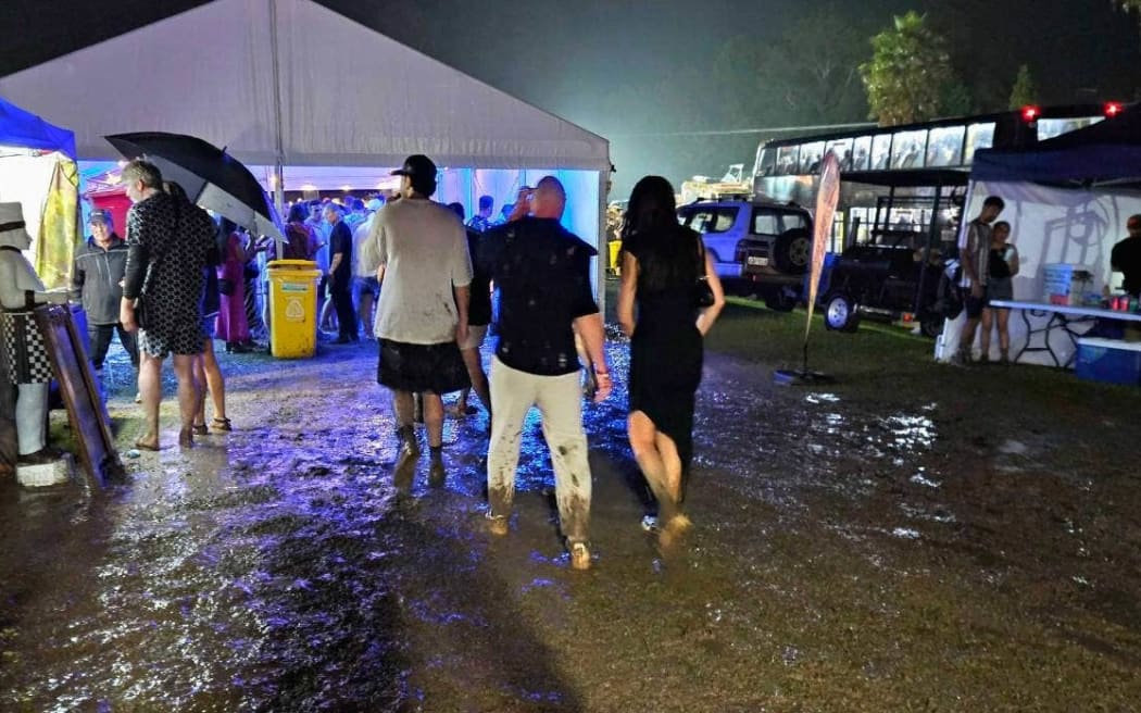 New Year's Eve festival-goers faced mud at the Highlife Festival at Ascension Wine Estate in Matakana.