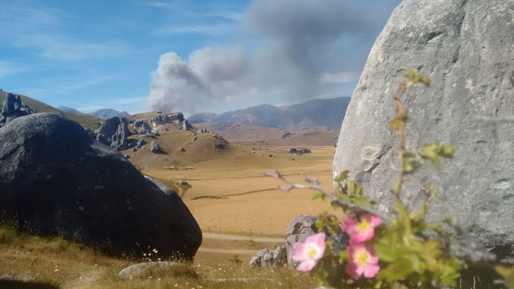 Smoke rises from a blaze burning at Stock Hill Station.