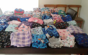 pyjamas folded on a bed