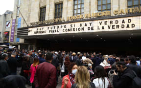 BOGOTA, COLOMBIA - JUNE 28: Hundreds of people attend the delivery of the final report of the Truth Commission at the Jorge Eliecer Gaitan Theater in Bogota, Colombia, on June 28, 2022. The commission is a body in charge of discovering and reveal past wrongdoing by a government, hoping to resolve conflicts left in the past. According to the president of the commission, Father Francisco de Roux, it is a document with "inconvenient truths" and a message to stop the conflict. Juan David Moreno Gallego / Anadolu Agency (Photo by Juan David Moreno Gallego / ANADOLU AGENCY / Anadolu Agency via AFP)