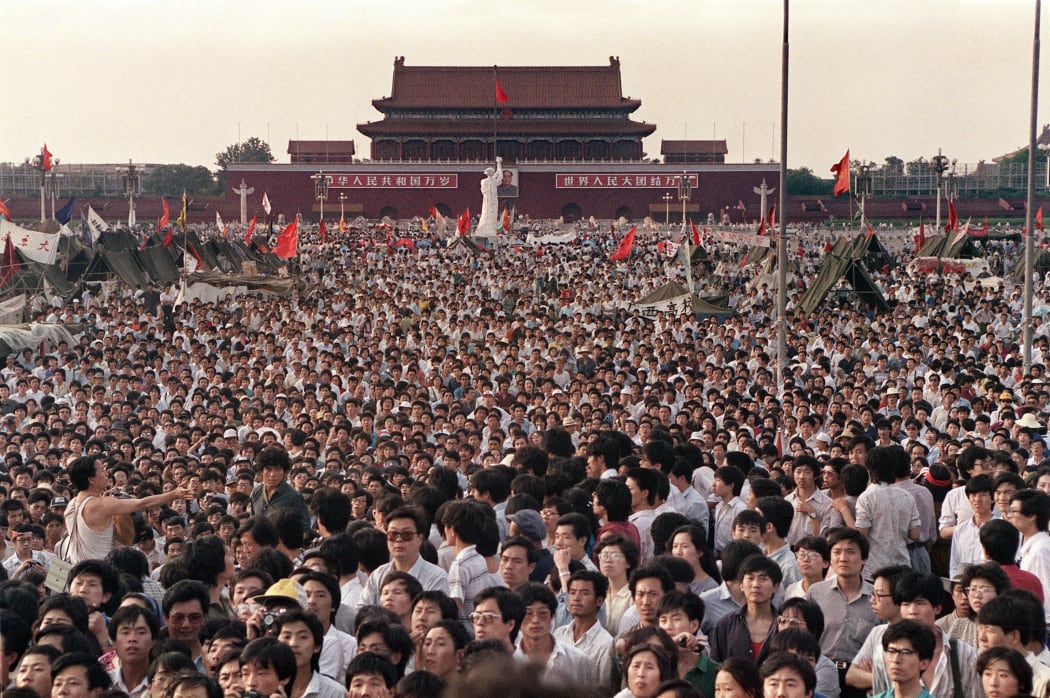 This file photo taken on 2 June 1989 shows people gathered at Tiananmen Square during a pro-democracy protest in Beijing.
