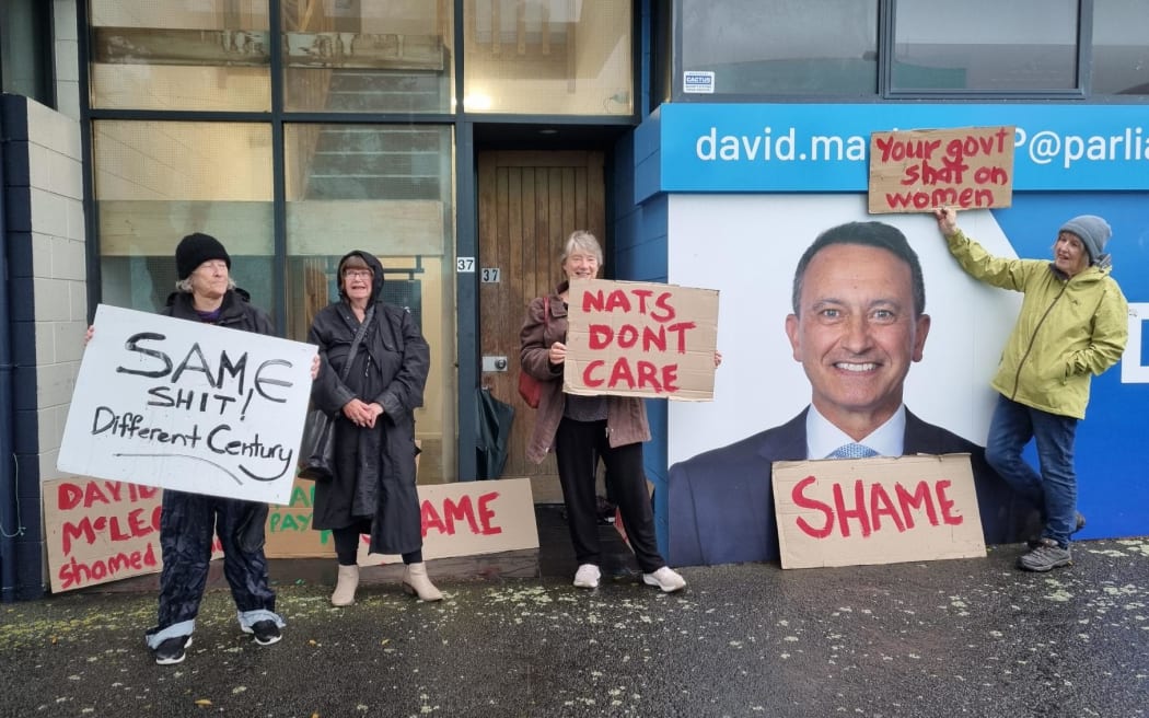 Pay equity protesters brave torrential downpour to picket New Plymouth MP David McLeod's office.