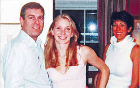 A photograph appearing to show Prince Andrew with Jeffrey Epstein's accuser Virginia Roberts Giuffre and Ghislaine Maxwell.