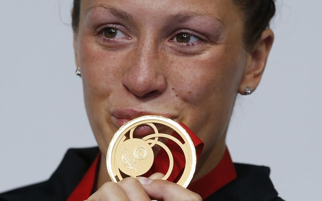 New Zealand's Sophie Pascoe kisses her gold medal.