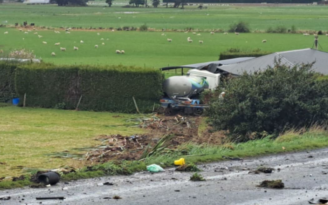 The truck crashed into a house after colliding with a car on State Highway 1 at Edendale.