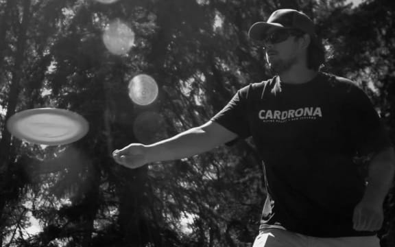 a man playing disc golf