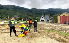 Students making sandbags in Anakiwa.
