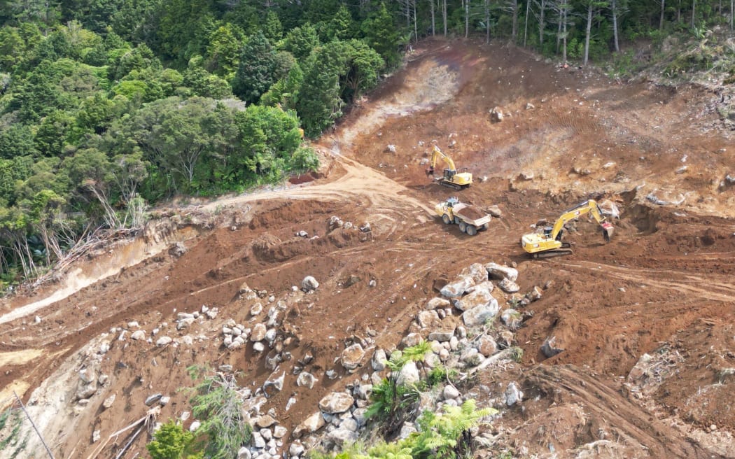 At the top of the massive Helena Bay Hill landslide and a month into the hands-on part of the job diggers on March 18, fill one of 15,000 truckloads carrying away its 250,000 tonnes of debris. Physical slip clearance work started on February 25 after several weeks of planning.