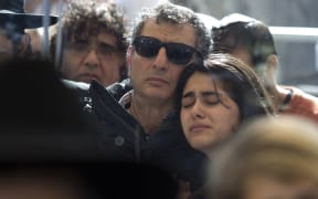Mourners at the funerals of Yohan Cohen, Philippe Braham, François-Michel Saada and Yoav Hattab in Jerusalem.