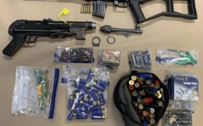 Police recovered an AK-47 and a submachine gun in the raid.