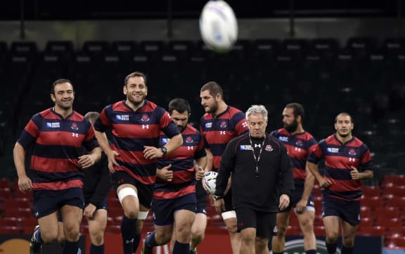 Georgia's head coach Milton Haig 
and captain Mamuka Gorgodze lead the captain's run at the Millennium stadium in Cardiff.