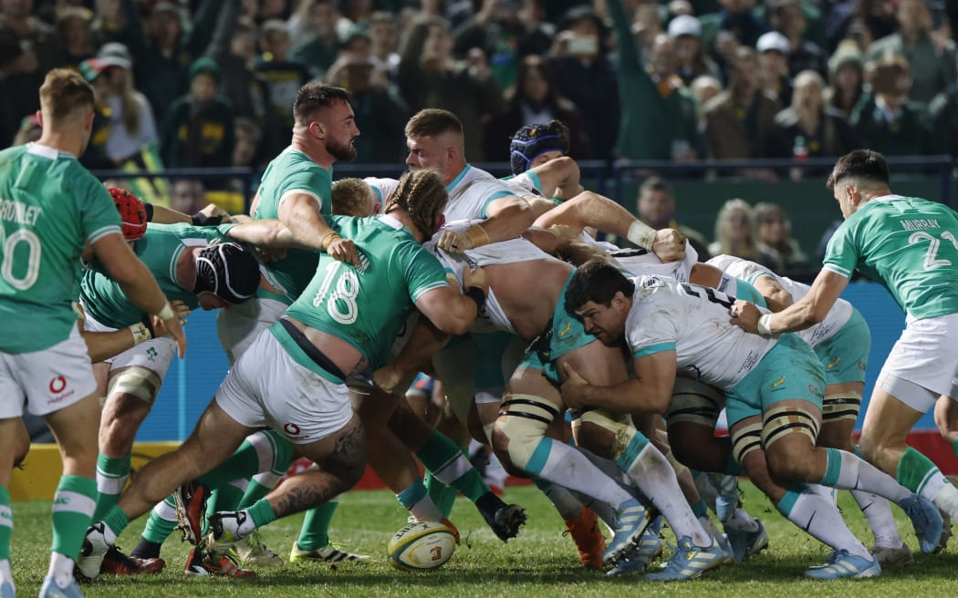 Ireland and South African players compete in a scrum before South Africa is awarded a penalty try during the first Rugby Union test match between South Africa and Ireland at Loftus Versfeld stadium in Pretoria on July 6, 2024. (Photo by Marco Longari / AFP)