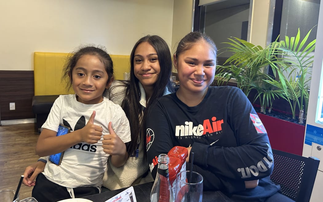A photo of three girls