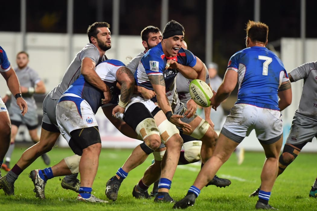 Kane Le'aupepe offloads during Manu Samoa's test against Georgia in November.