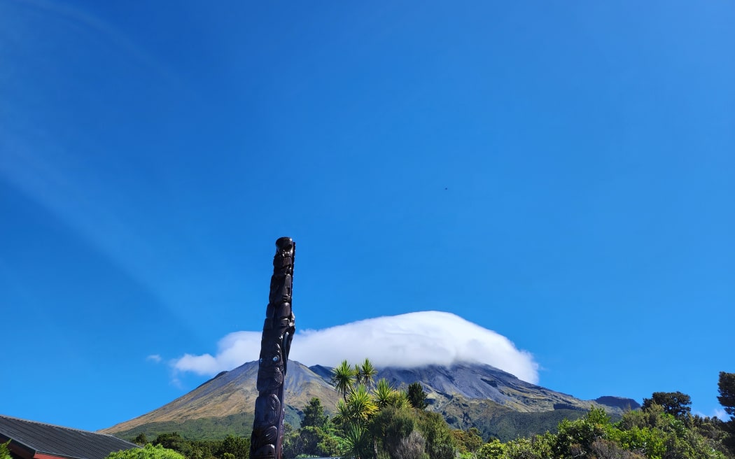 The peak of Mt Taranaki wreathed in cloud
