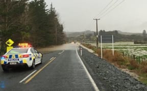 Surface flooding has closed roads north of Auckland.