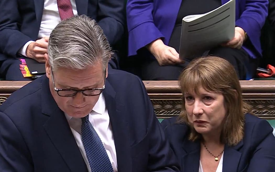 In this video grab taken from footage broadcast by the UK Parliamentary Recording Unit (PRU) via the Parliament TV website on July 2, 2025, Britain's Chancellor of the Exchequer Rachel Reeves appears tearful during the Prime Minister's Questions (PMQ) session in the House of Commons. (Photo by PRU / AFP) / RESTRICTED TO EDITORIAL USE - NO USE FOR ENTERTAINMENT, SATIRICAL, ADVERTISING PURPOSES - MANDATORY CREDIT " AFP PHOTO / PRU "