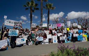 Demonstrators at the Sea World drive protesting against holding Orcas in captivity at Sea World, in March 2014.